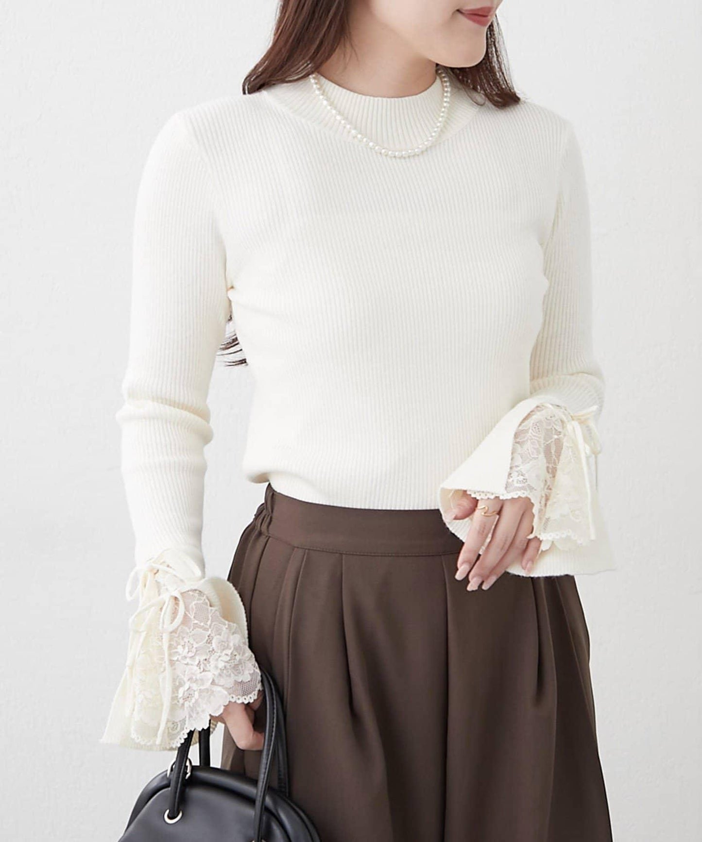 袖部蕾絲拼接蝴蝶結針織上衣