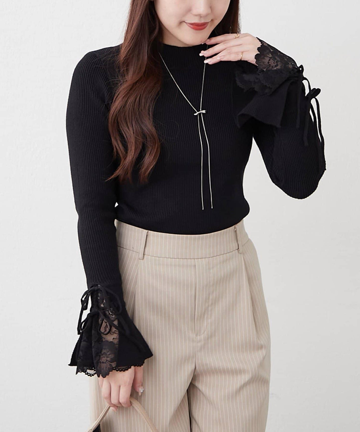 袖部蕾絲拼接蝴蝶結針織上衣