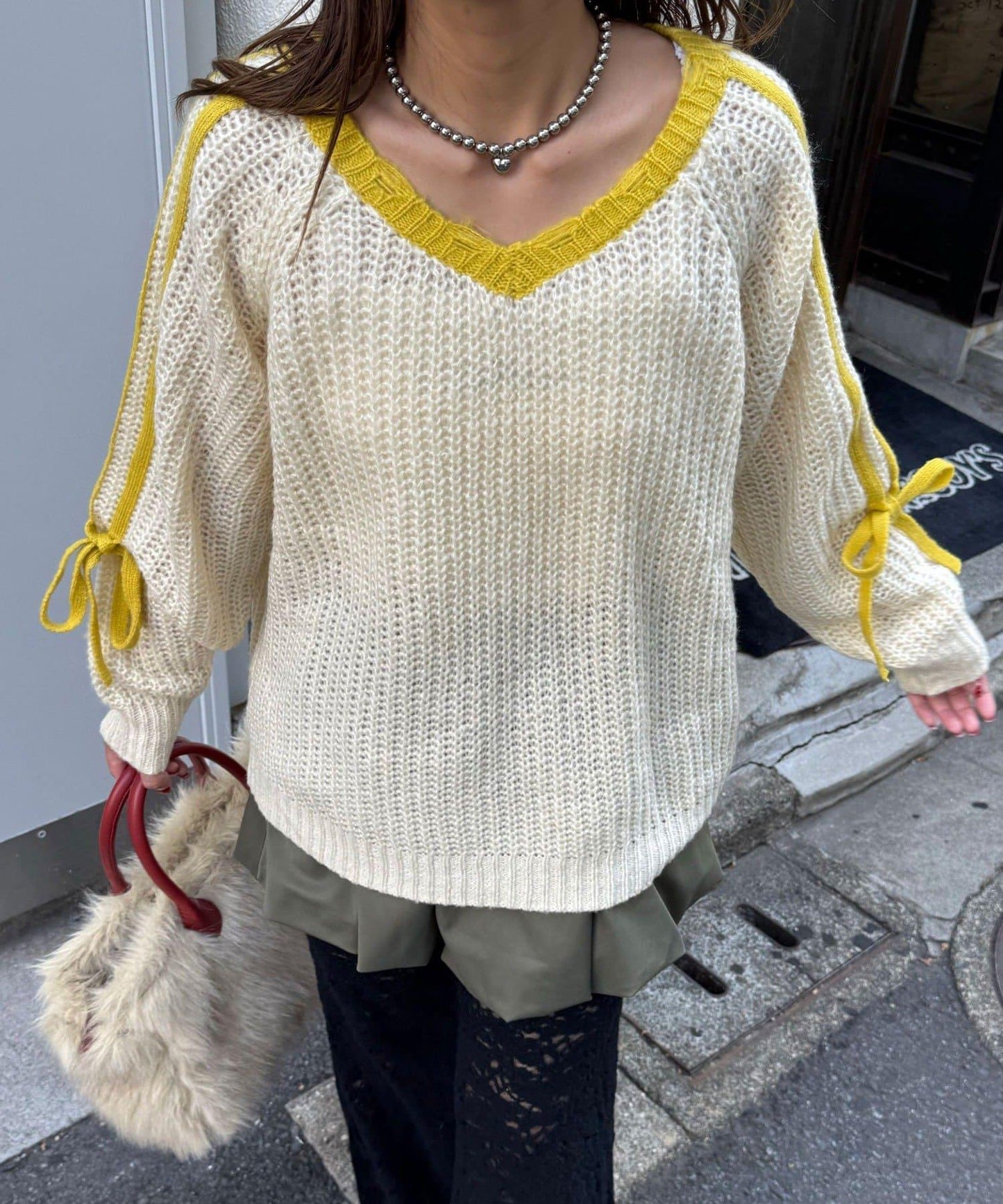 袖部條紋蝴蝶結插肩袖針織衫