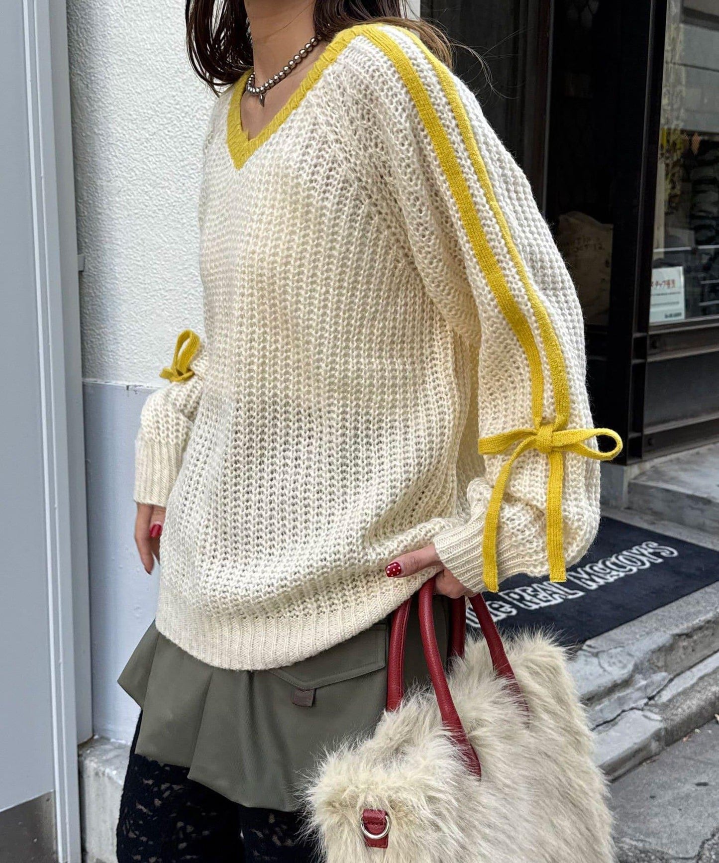 袖部條紋蝴蝶結插肩袖針織衫