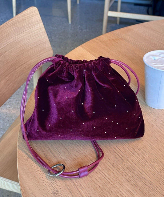 帶卡拉賓的絨面鉚釘束口袋