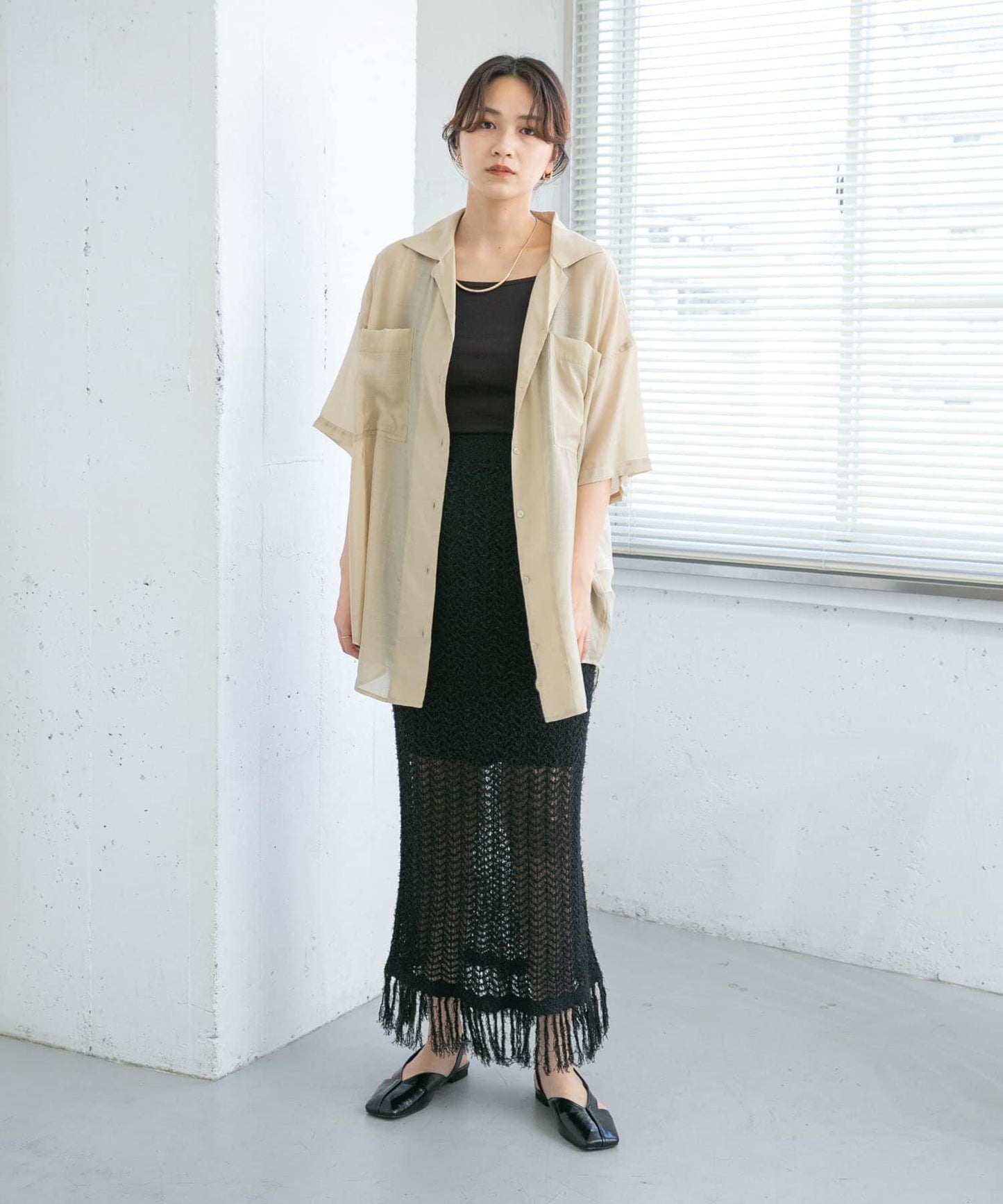 流蘇鏤空針織半身裙