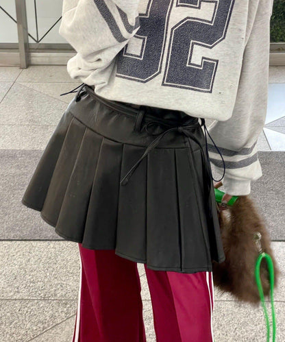 皮革百褶包裹式迷你裙