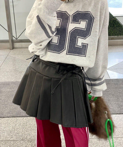 皮革百褶包裹式迷你裙