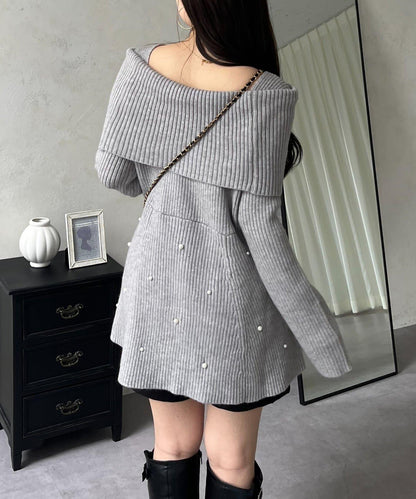 【防靜電】下襬珍珠一字肩荷葉邊針織衫