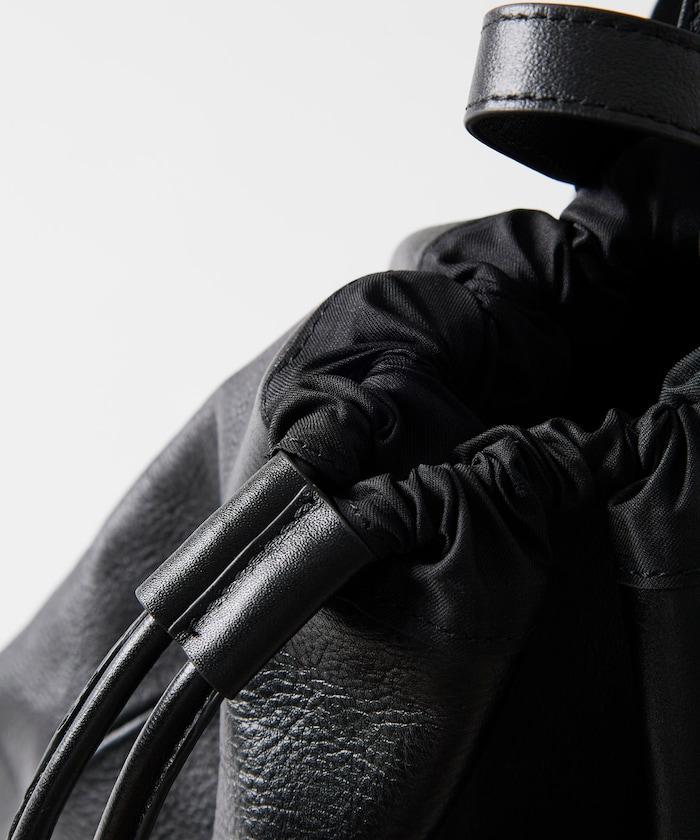 防潑水牛皮束口單肩包