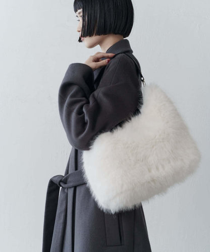 波浪扣皮革手柄毛絨揹包