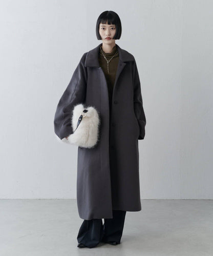 波浪扣皮革手柄毛絨揹包