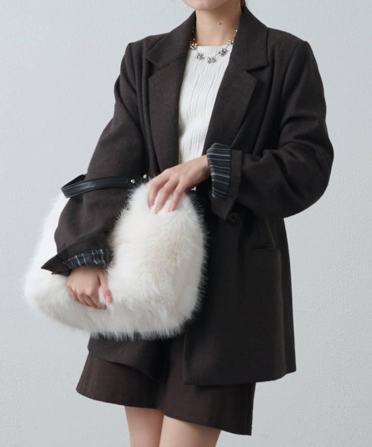 波浪扣皮革手柄毛絨揹包