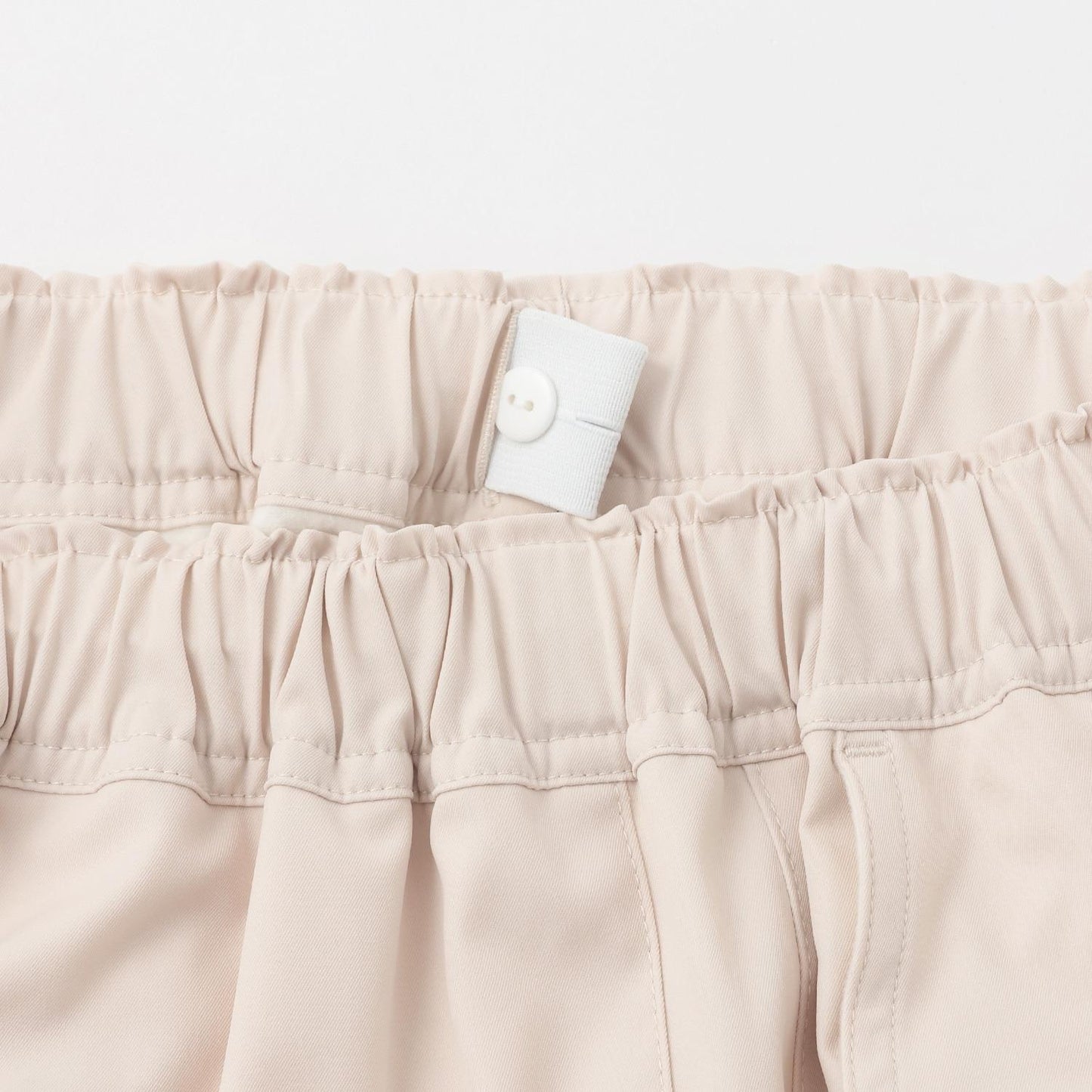 側邊標誌蝴蝶結內里加絨降落傘褲