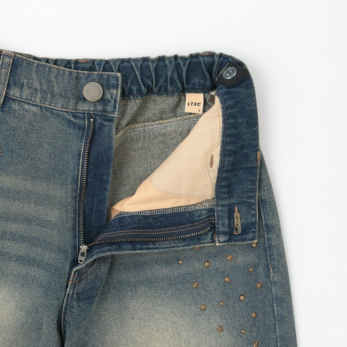 鉚釘流蘇牛仔褲