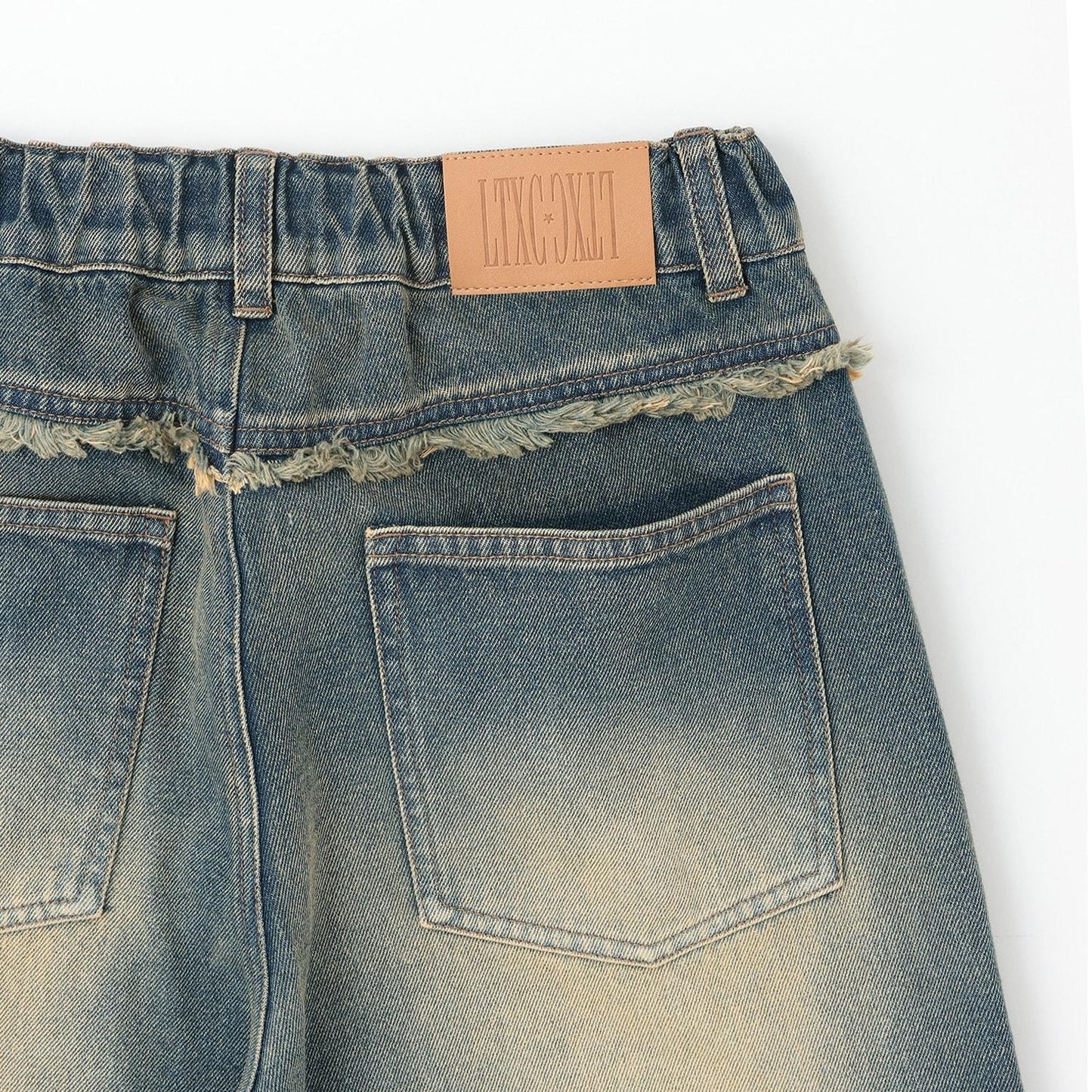 鉚釘流蘇牛仔褲