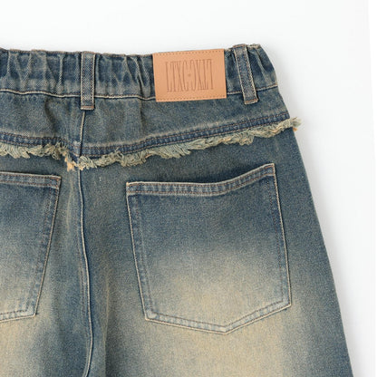 鉚釘流蘇牛仔褲