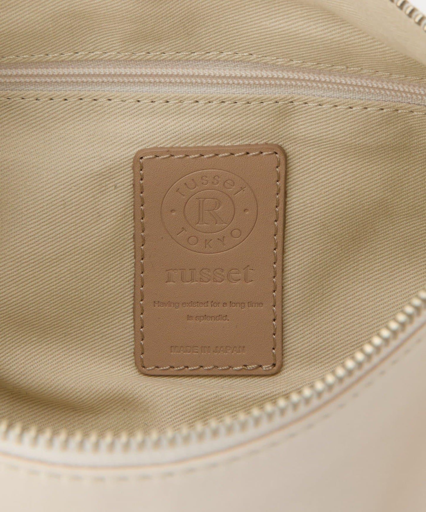 軟皮卷式單肩包