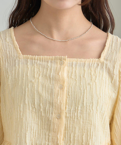 提花下襬荷葉邊襯衫