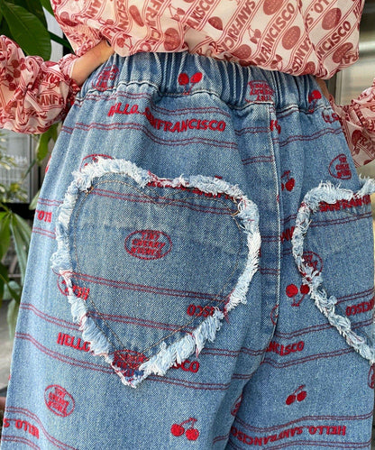 下襬荷葉邊滿版刺繡寬鬆闊腿牛仔褲