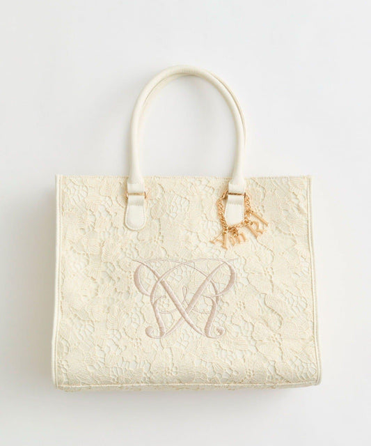 エメリレース → 含有“蕾絲”設計的描述性詞 キャリーオン → 可登機 / 行李杆套設計（描述性，可中文化） トート → 托特包（子品類） 最終商品名如下： 柔美蕾絲設計 可套行李杆 托特包