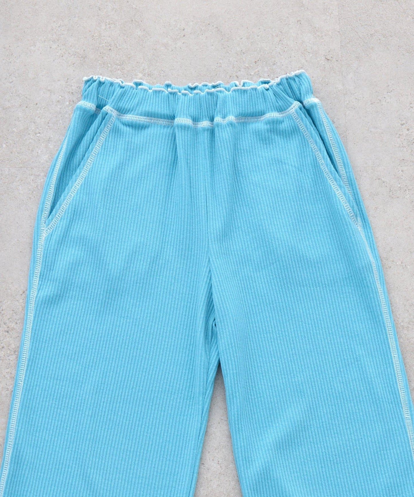 褲腳荷葉邊撞色走線微喇羅紋褲子