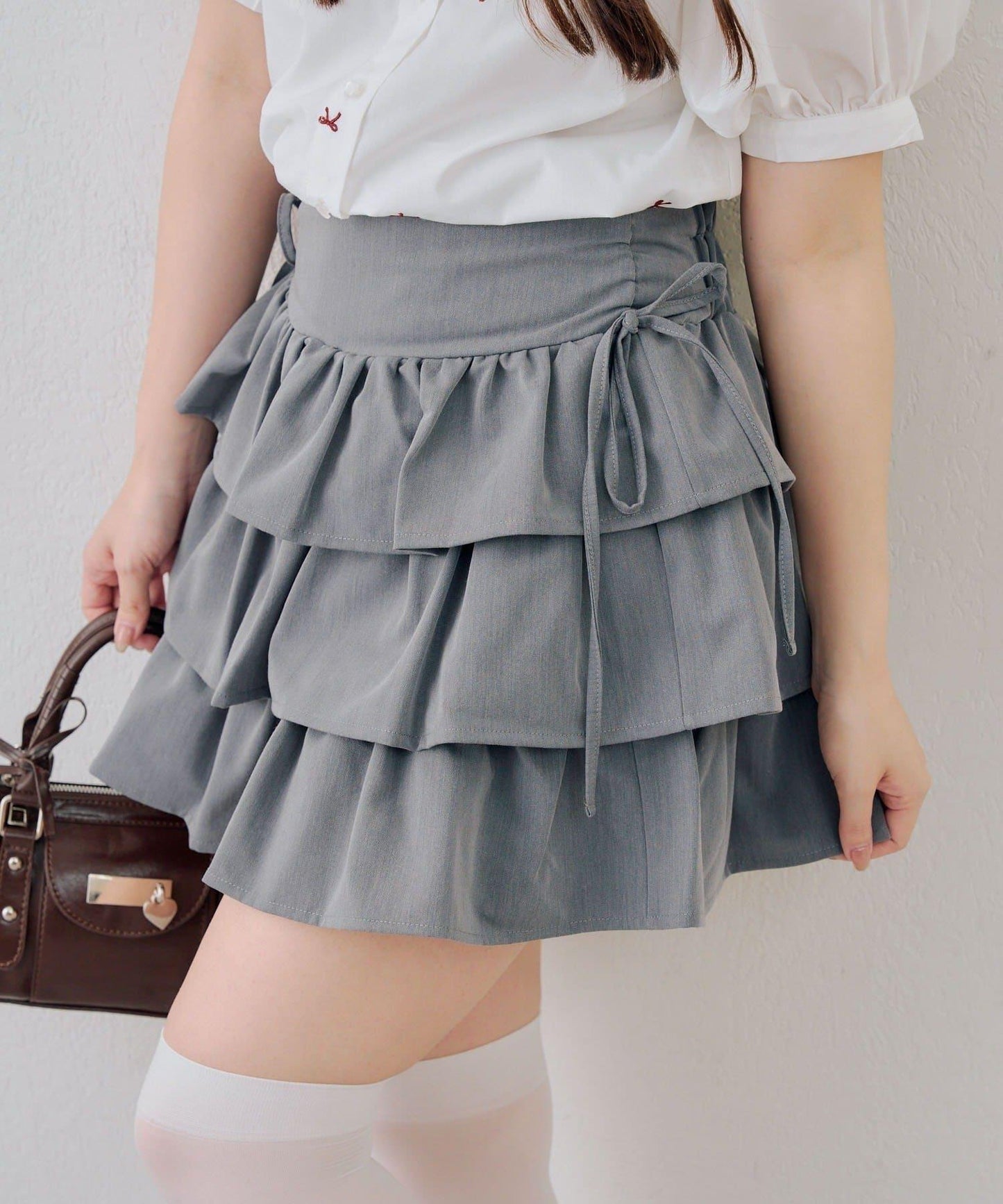 側邊蝴蝶結層疊迷你半身裙